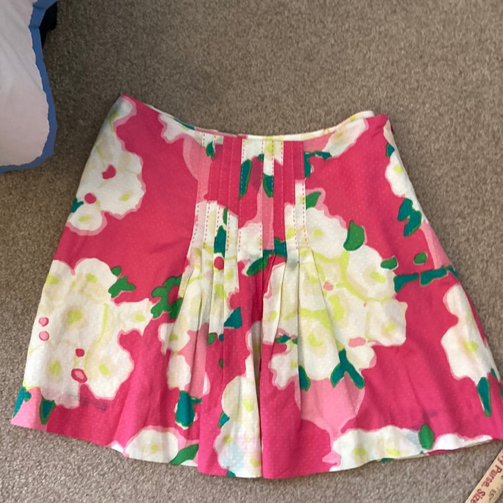 Lilly Pulitzer skirt. Pink white and yellow floral. Center front pleats. Lined